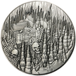 Silver metal coin with treasure chest and skulls in cavern