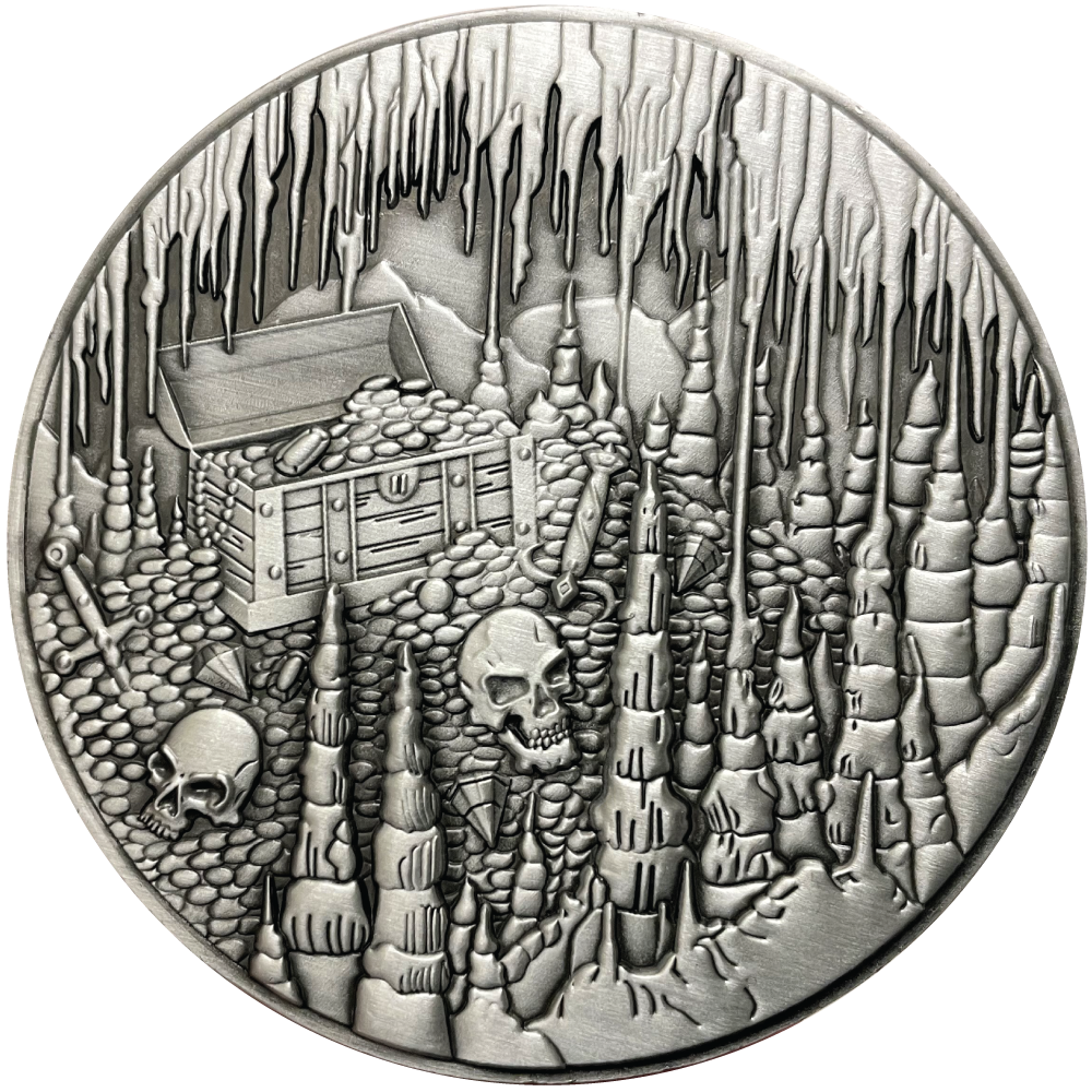 Silver metal coin with treasure chest and skulls in cavern