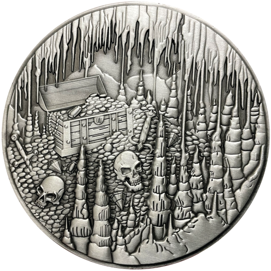 Silver metal coin with treasure chest and skulls in cavern