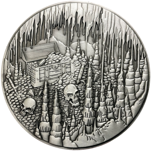 Silver metal coin showing treasure chest, skulls, and cavern