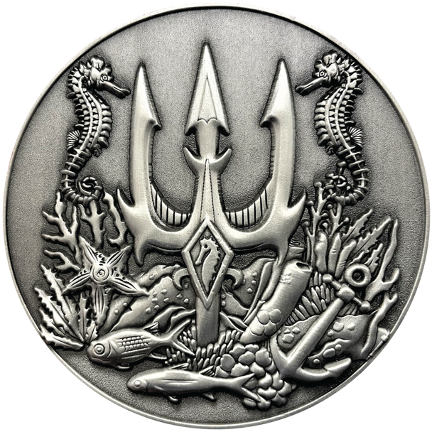 Silver metal coin with trident, seahorses, and fish