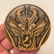 Copper metal coin in hand showing dragon head