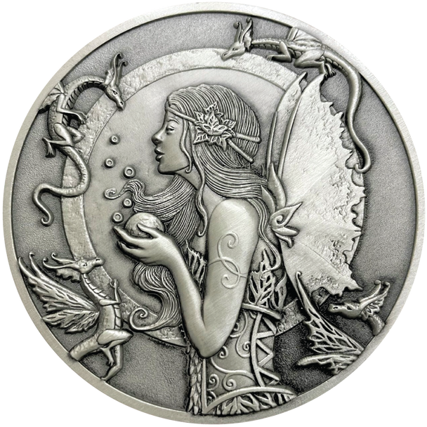 Silver metal coin showing fairy with small dragons around her