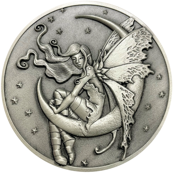 Silver metal coin showing fairy sitting on moon