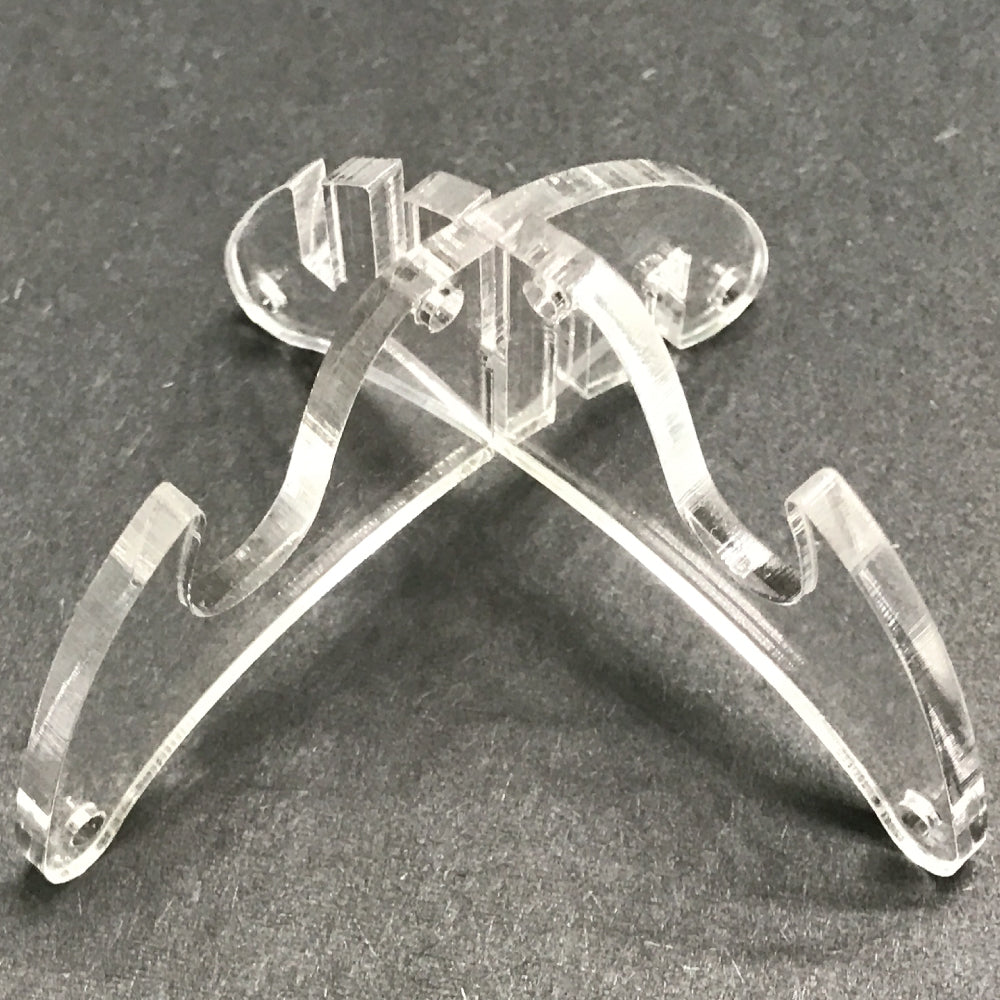 Plastic display stand in shape of an X